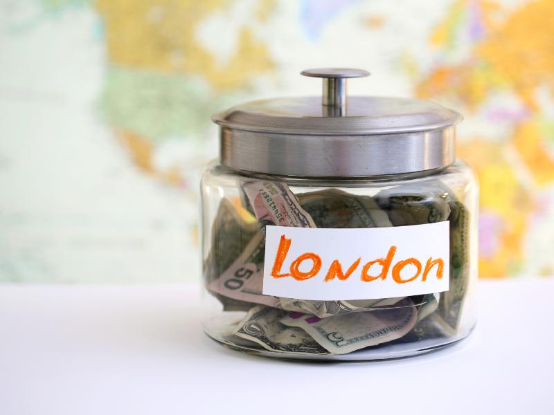 Jar with money and label London.