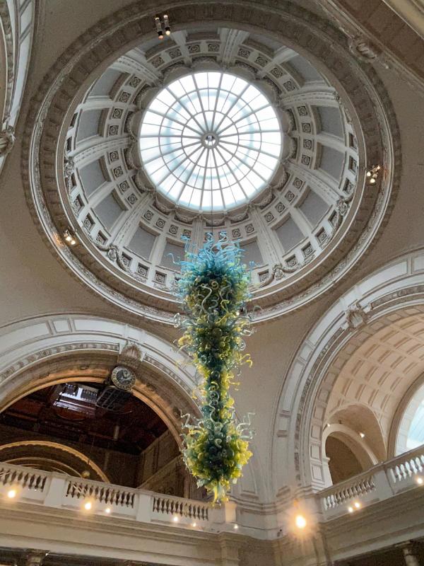 Glass ornament hanging from a ceiling.