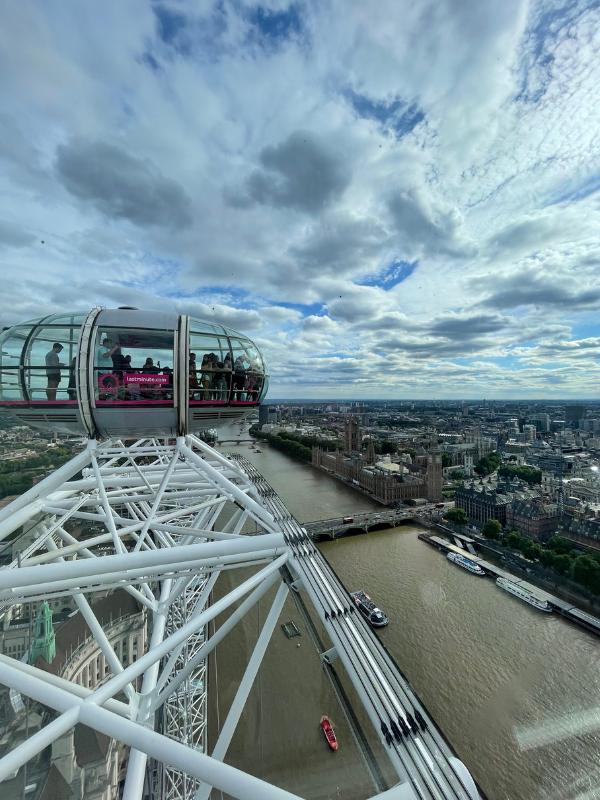 Visiting the London Eye for views of the London skyline and Thames.
