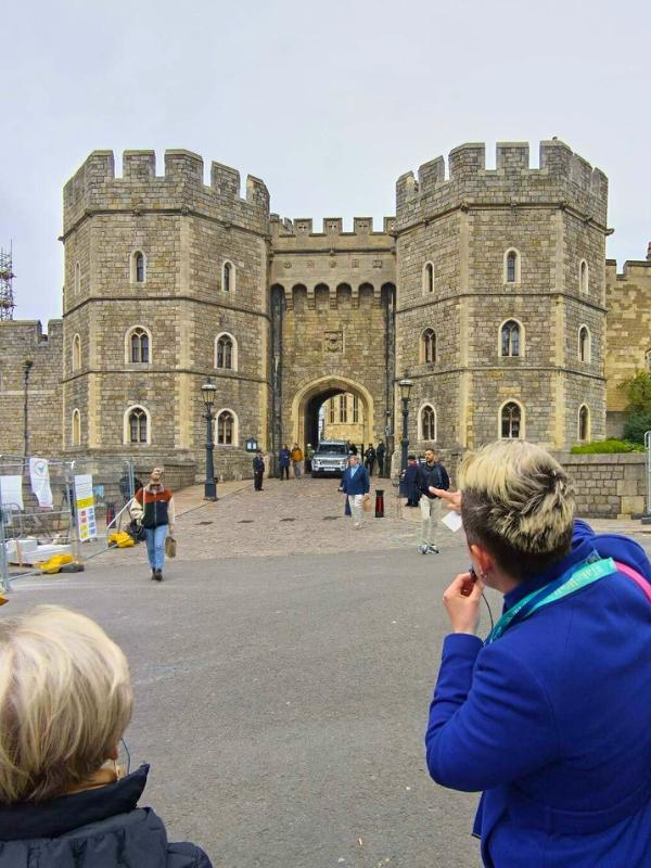a woman pointing at a castle/