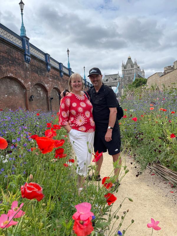 Man and woman in a garden.