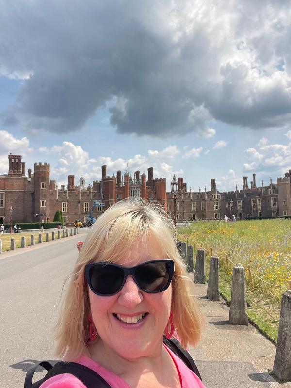 Lady standing at Hampton Court Palace.
