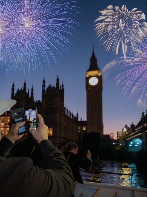 Fireworks over Big Ben and the Houses of Parliament, photographed from the deck of a Thames cruise on New Year's Eve.