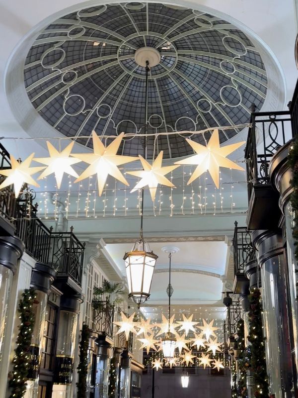Star lights hanging beneath the glass dome of Princes Arcade off Piccadilly.