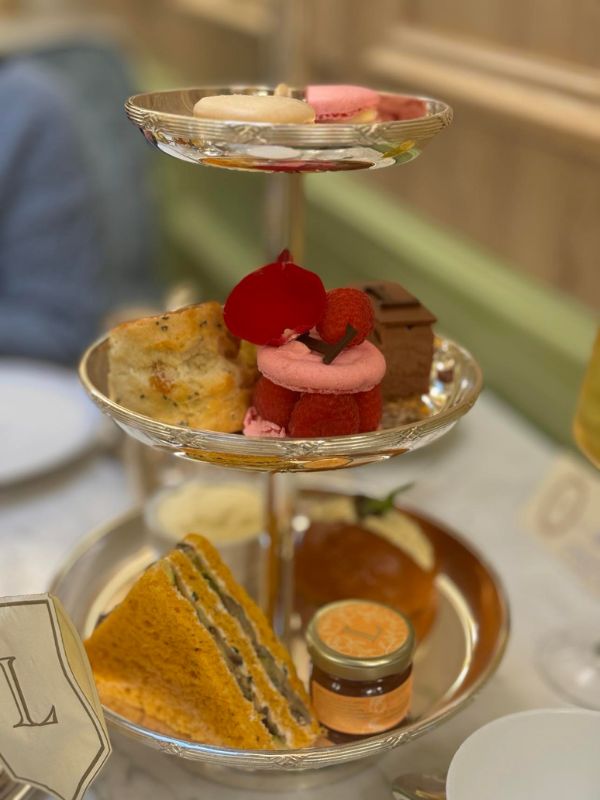 Three-tier silver stand at Ladurée Covent Garden afternoon tea with macarons, Ispahan and scones