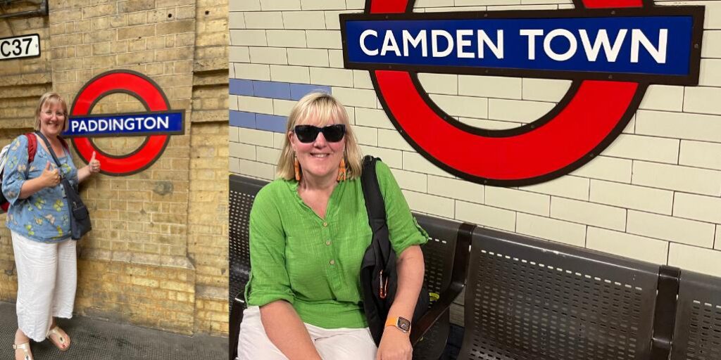 Lady sitting under a sign