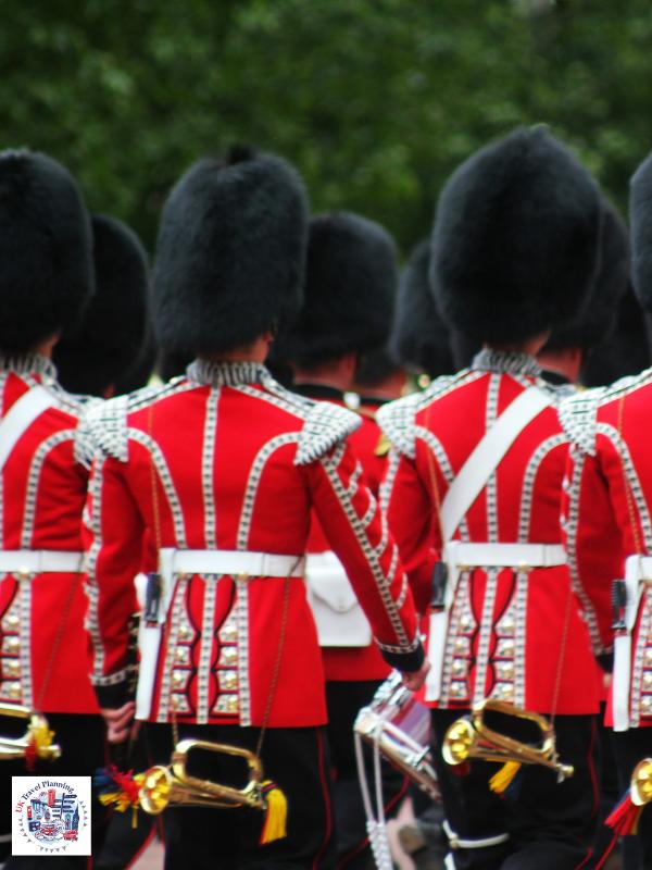 Soldiers in red tunics and bearskin hats marching during Trooping the Colour a key event in London in June.