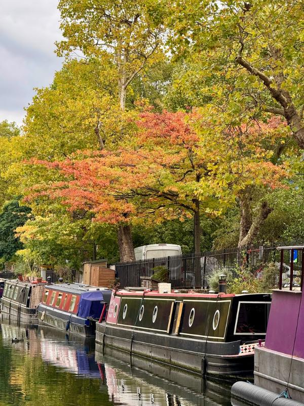 Colourful narrowboats moored at Little Venice, London in September