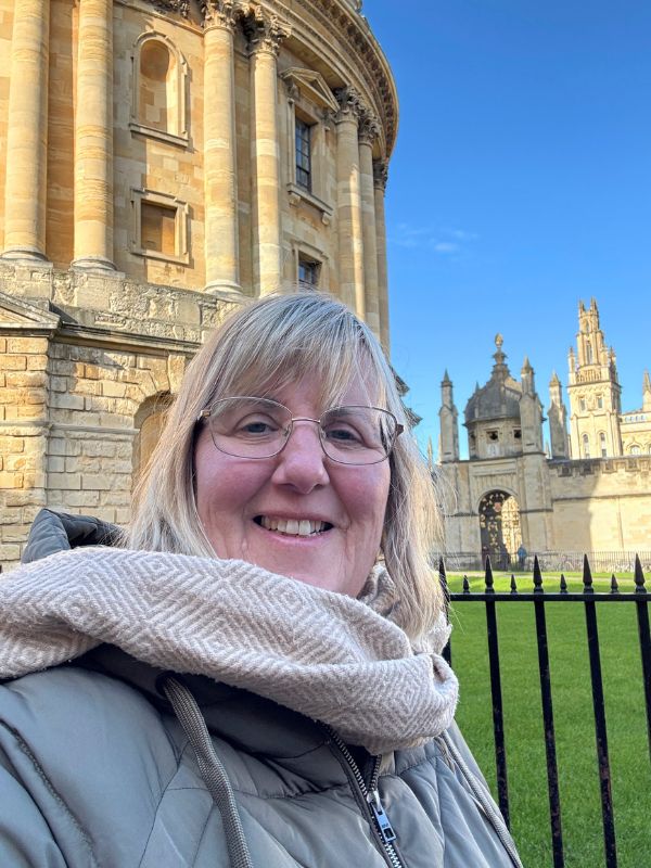 Tracy in front of the Radcliffe Camera in Oxford on an English Bus day tour