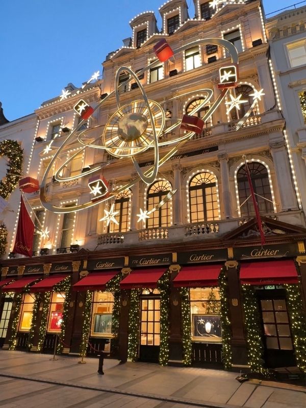 Star and planet Christmas lights above the Cartier store on New Bond Street
