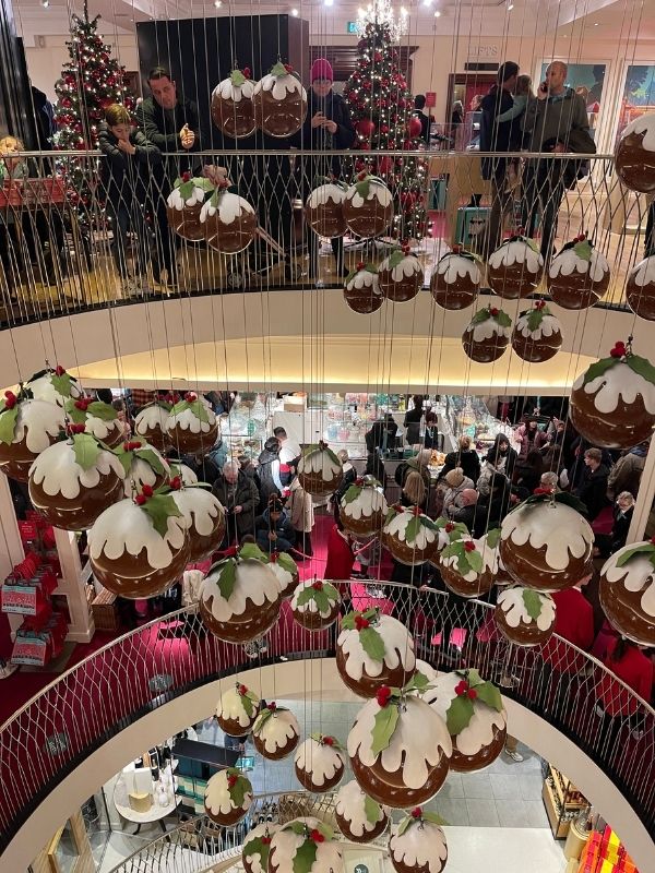 Christmas puddings hanging in the Fortnum and Mason food hall in London