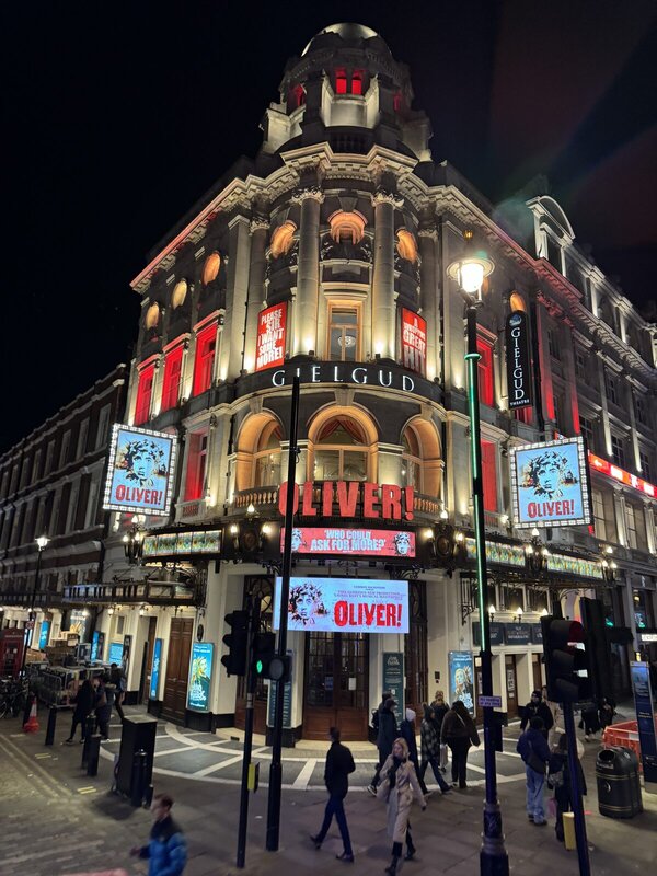 West End theatre lit up at night in November with Oliver! playing at the Gielgud Theatre 