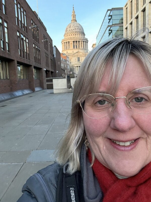 Tracy Collins in front of the dome of St Paul's Cathedral on a clear November morning in London
