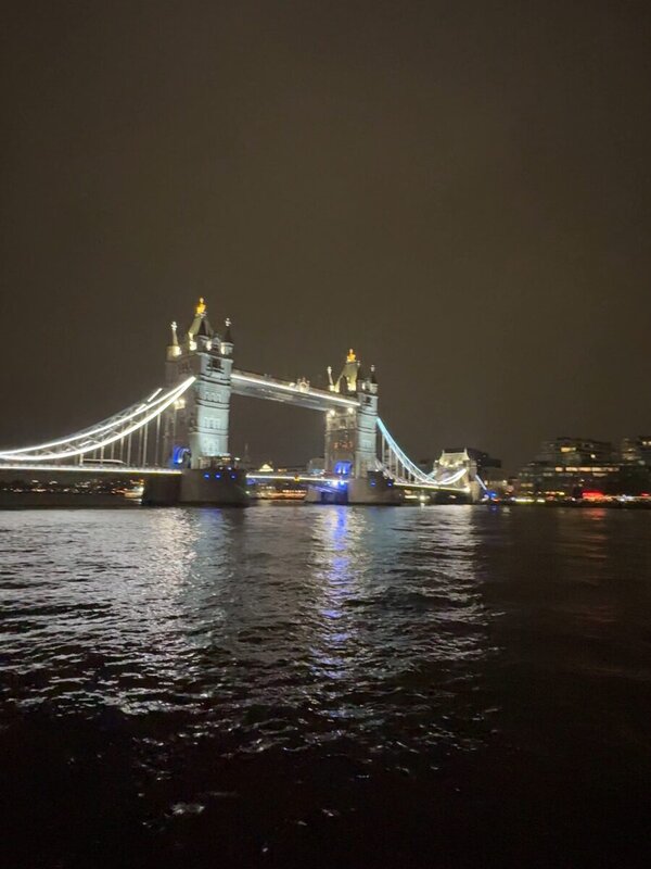 Tower Bridge floodlit at night seen from the River Thames in London in November 