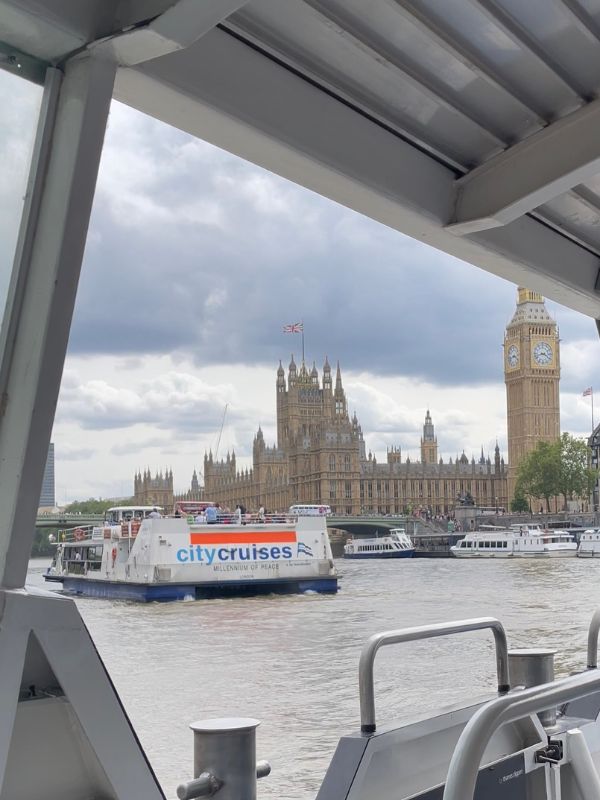 City Cruises sightseeing boat on the Thames with Big Ben behind