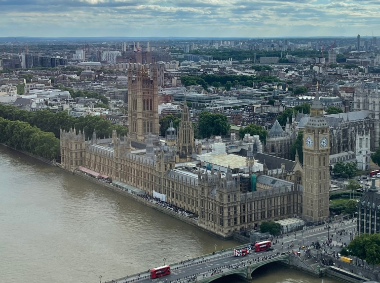 The Houses of Parliament and Big Ben beside the River Thames, seen from above