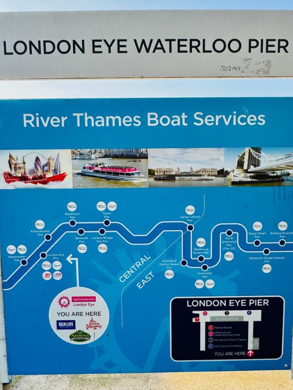Sign at a Thames pier in London for river bus and sightseeing boats