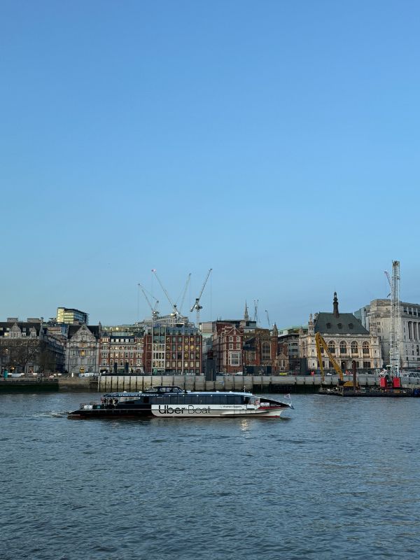 Uber Boat by Thames Clippers river bus on the River Thames in London