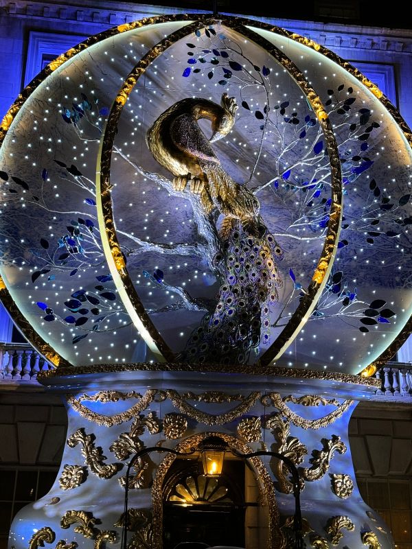 The illuminated peacock globe on the faรงade of Annabel's in Berkeley Square, Mayfair.