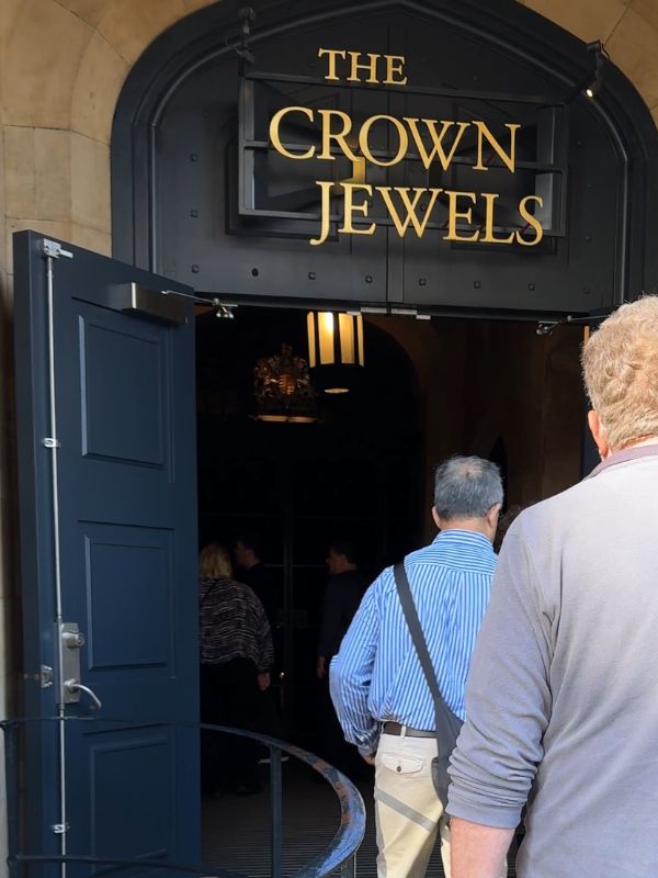 Visitors walking through the entrance to the Crown Jewels exhibition at the Tower of London