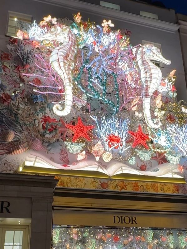 The Dior shop front on New Bond Street decorated with illuminated seahorses, coral and starfish.