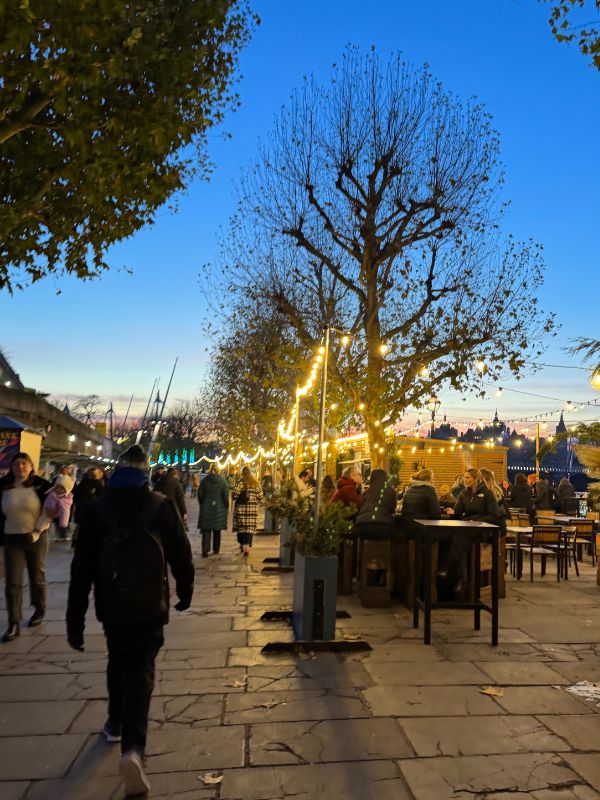 The Southbank Centre Winter Market at dusk with fairy lights