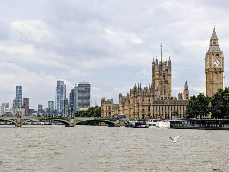 Houses of Parliament and Big Ben seen from the River Thames on a City Cruises boat