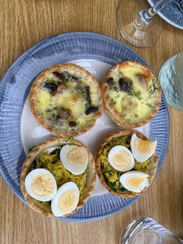 Savoury tartlets and quiches served on the afternoon tea cruise in London